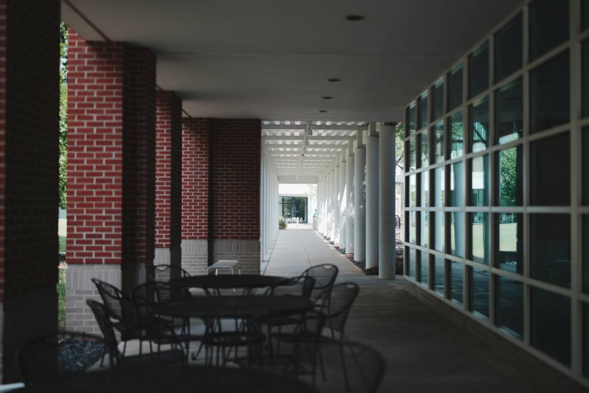 Durable outdoor gazebo chairs made of powder-coated aluminum with UV-resistant cushions on a cedar deck