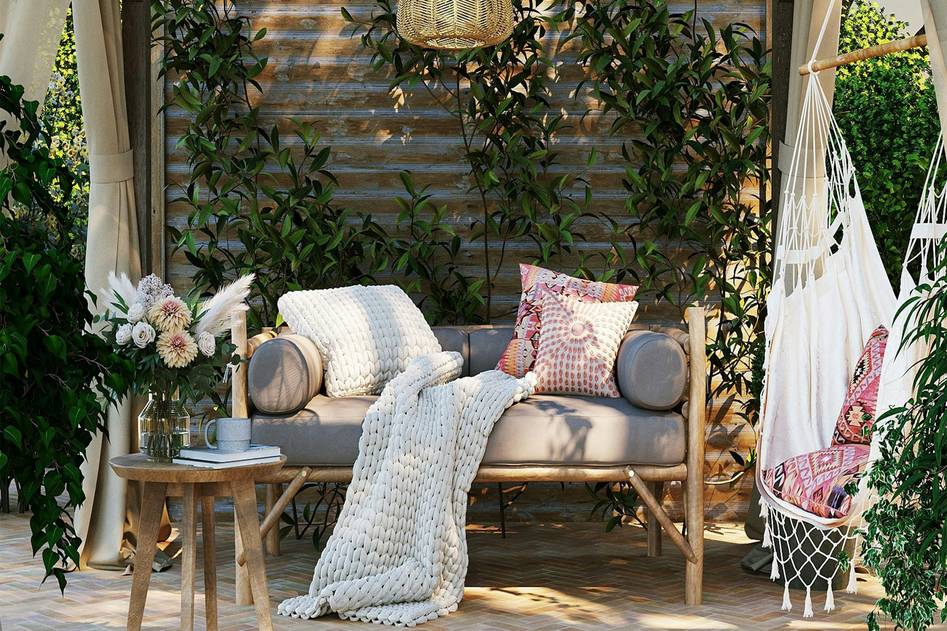 Elegant wooden gazebo with cushioned seating and lush garden backdrop