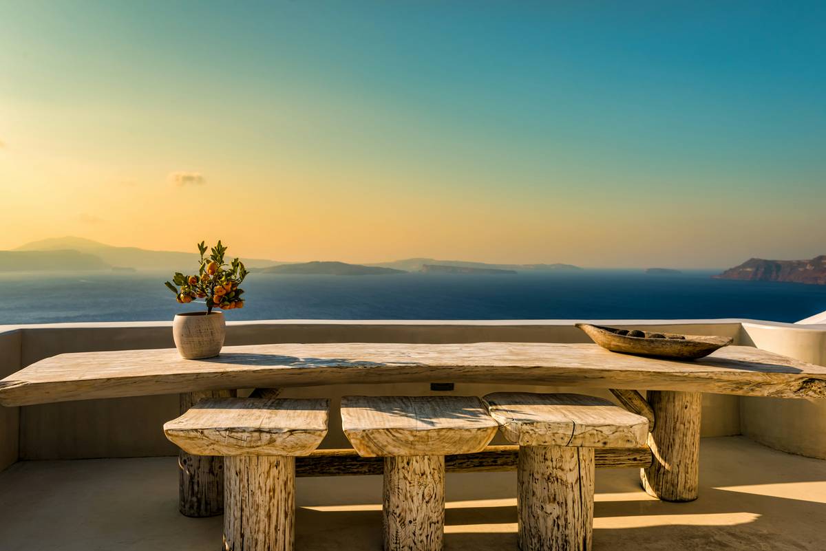 Durable outdoor gazebo furniture featuring quick-dry mesh cushions and compact folding table on wooden deck